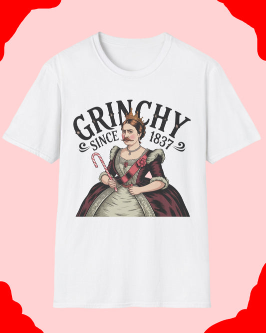White t-shirt with a graphic of a woman holding candy canes and text 'Grinchy Since 1837' on a white background.