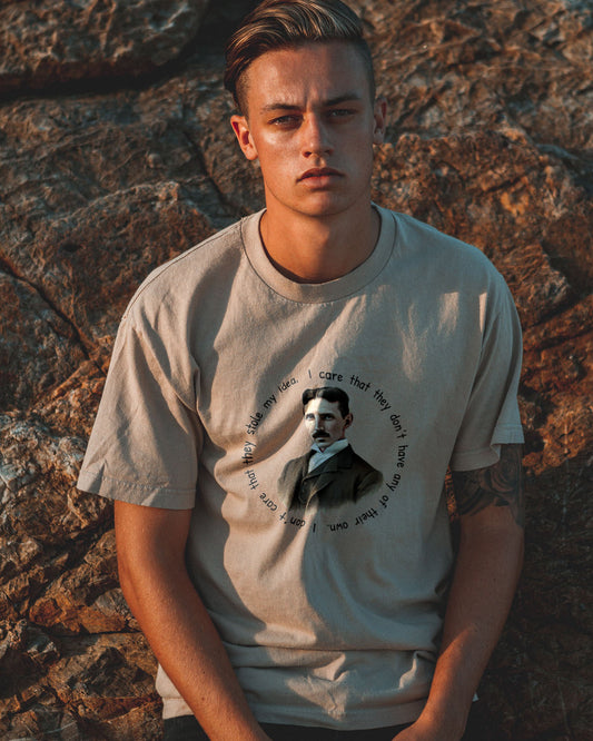 Sand T-Shirt with an image of Nikola Tesla and a quote from him.