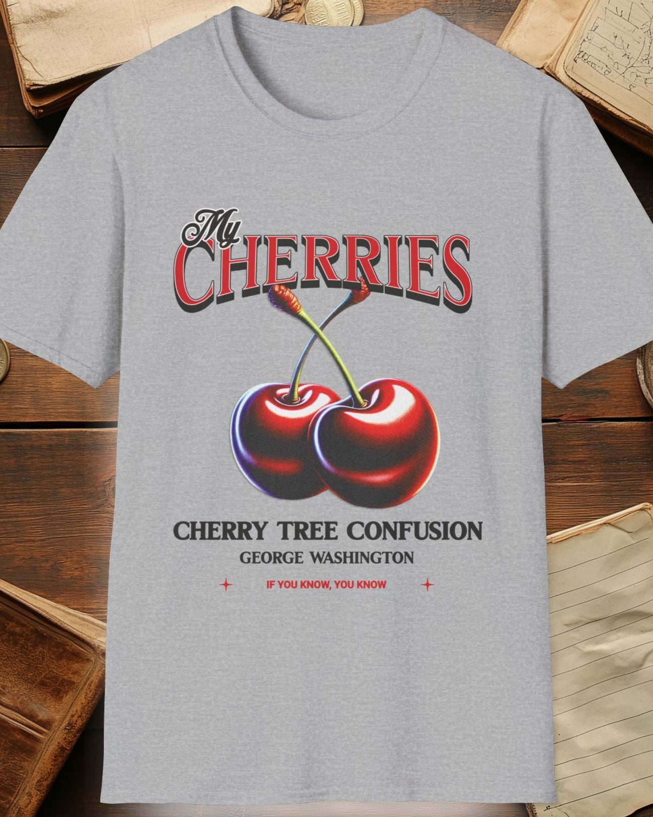 grey tshirt with charries and the text "The cherries, cherry tree confusion"