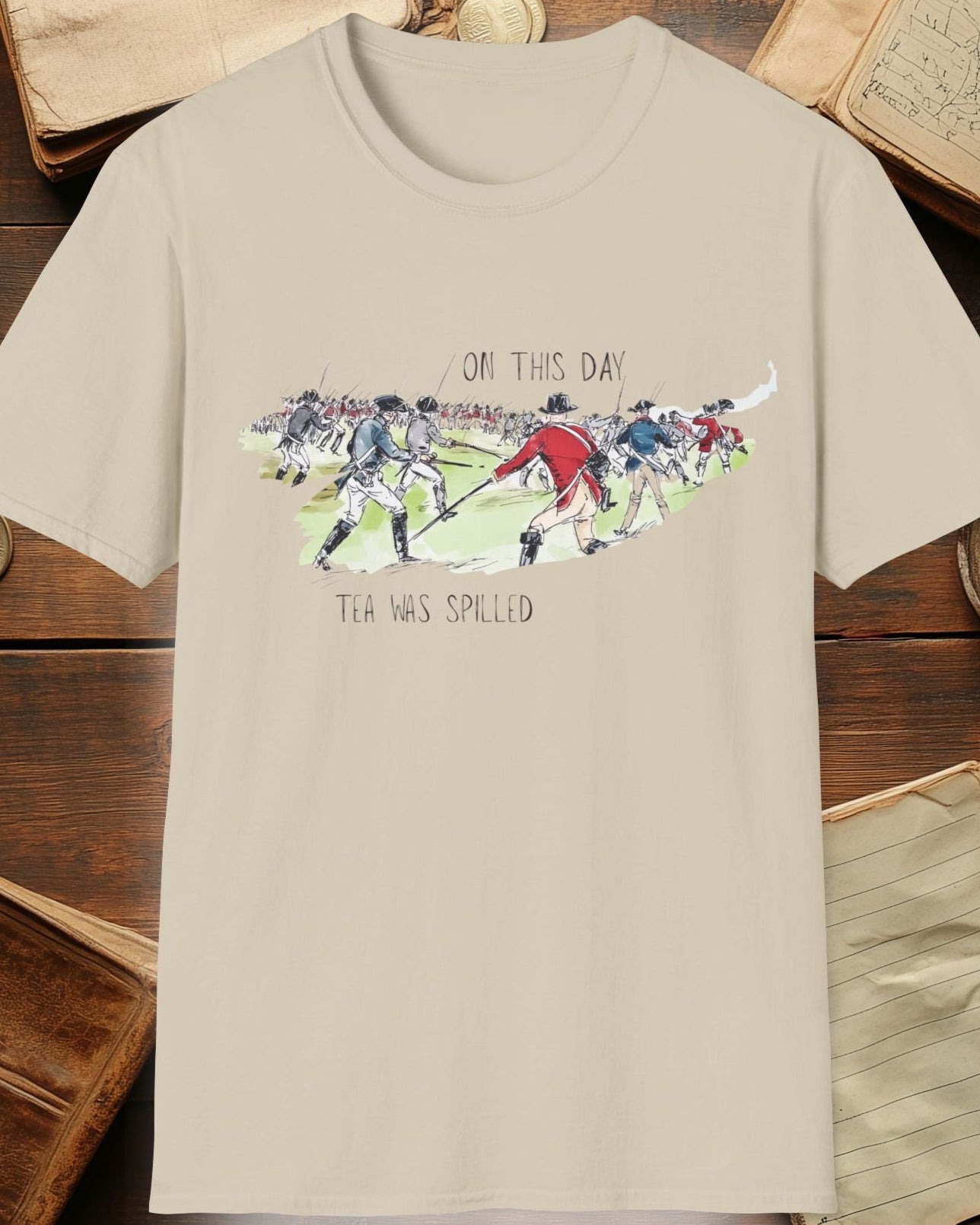 sand tshirt with a battlefield and the text "On this day, tea was spilled"