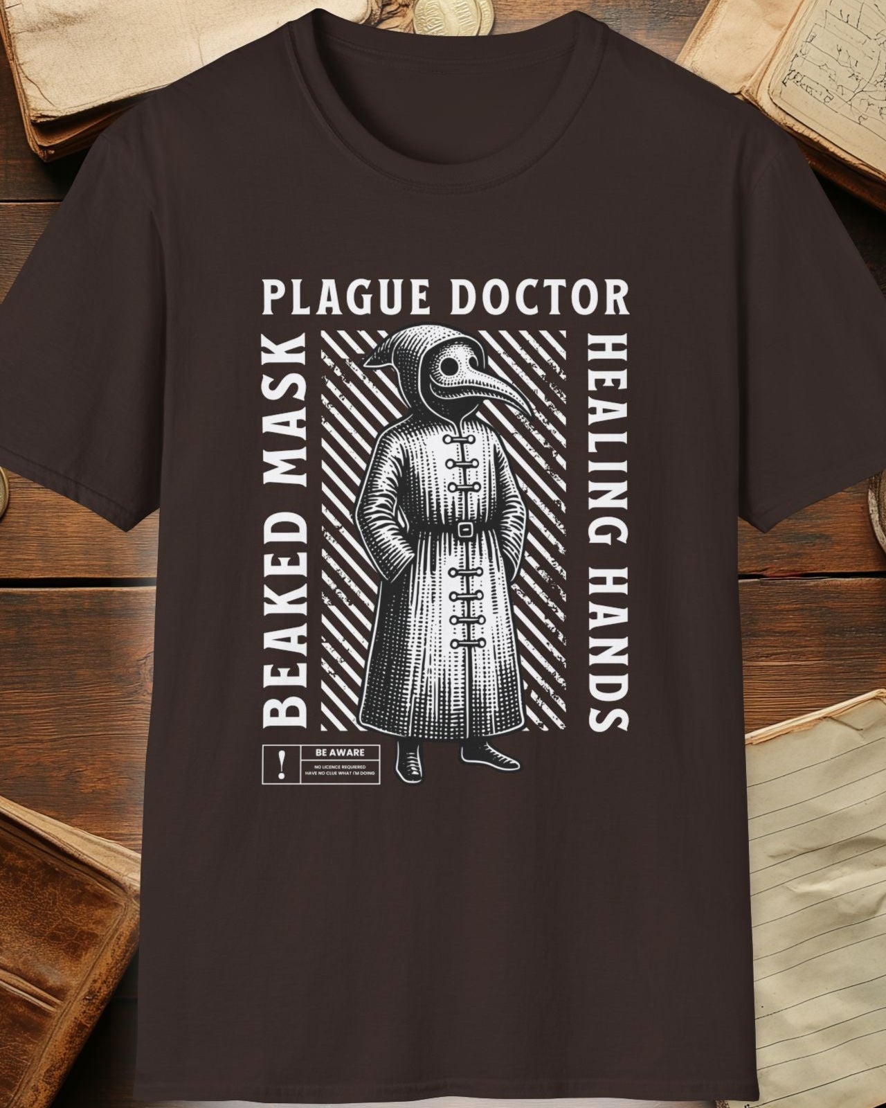 dark chocolate shirt with the plague doctor and the text "beaked mask,plague doctor, healing hands"