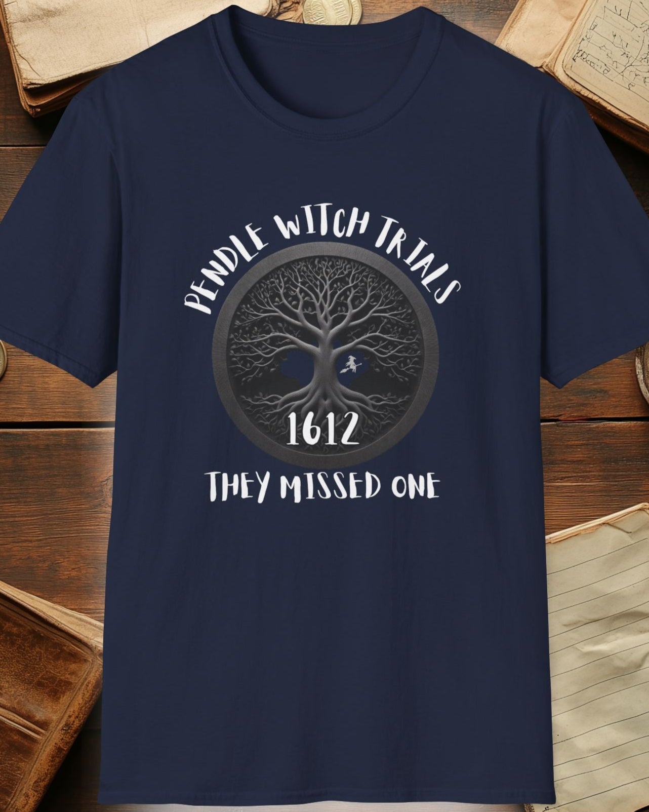 navy tshirt with the text "Pendle witch trials, they missed one"