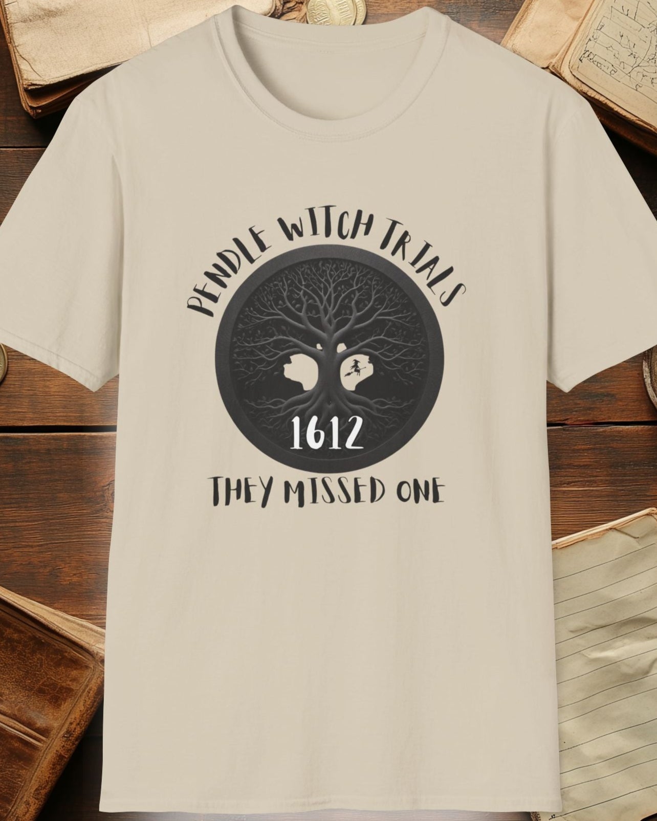 sand tshirt with the text "Pendle witch trials, they missed one"