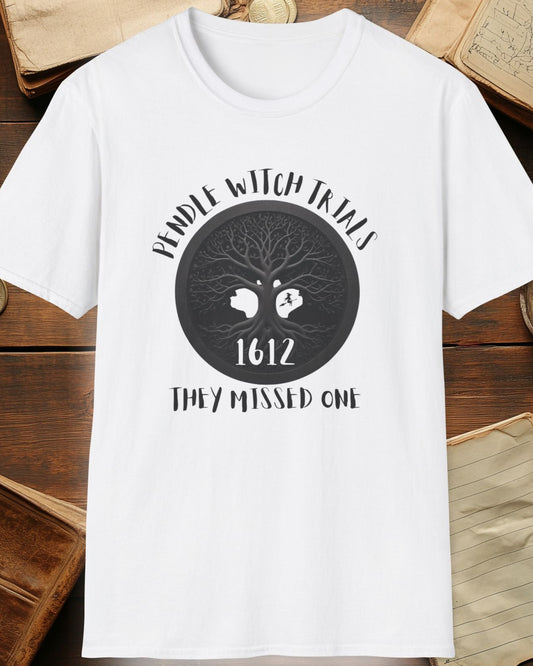 white tshirt with the text "Pendle witch trials, they missed one"