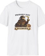 A white short-sleeve crewneck t-shirt featuring a vintage-style graphic of a bird character wearing a cowboy hat and holding a smoking pipe, with the text 'PROBABLY JUST ALLERGIES' printed on the front.