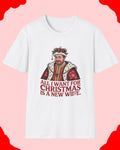 White t-shirt with a graphic of a man in a crown and text 'All I want for Christmas is a new wife.' on a white background.