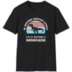 Black T-Shirt with the text "If history repeats itself I am so getting a Dinosaur". There is also a image of a dinosaur on a colourful background.  