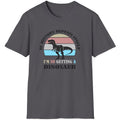 Charcoal T-Shirt with the text "If history repeats itself I am so getting a Dinosaur". There is also a image of a dinosaur on a colourful background.  