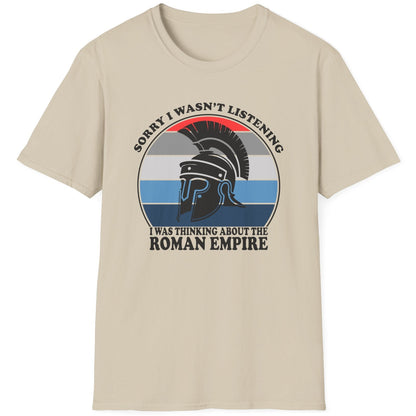 Sand coloured T-Shirt with the text "Sorry I wasn't listening I was thinking of the Roman Empire" and an image of a Roman helmet.