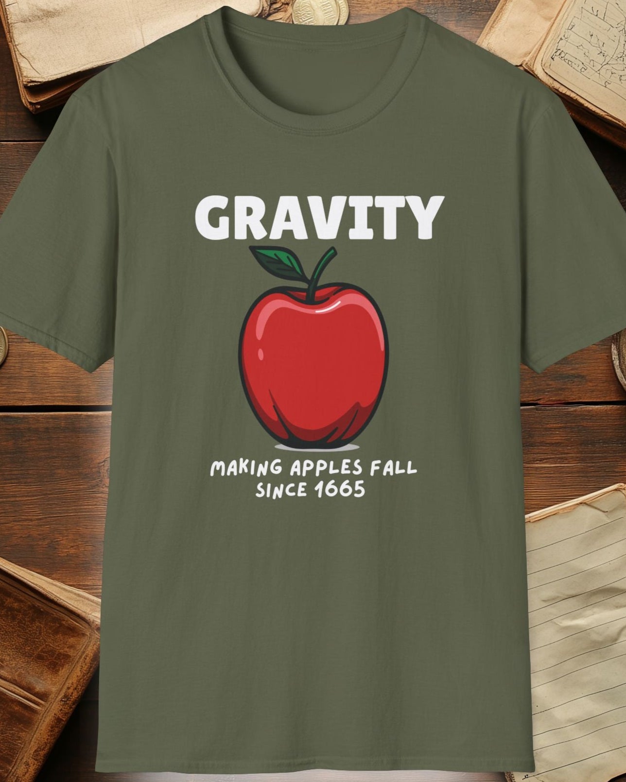 green tshirt with a apple and the text "Gravity, Making apples fall since 1665"