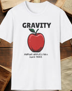 white tshirt with a apple and the text "Gravity, Making apples fall since 1665"