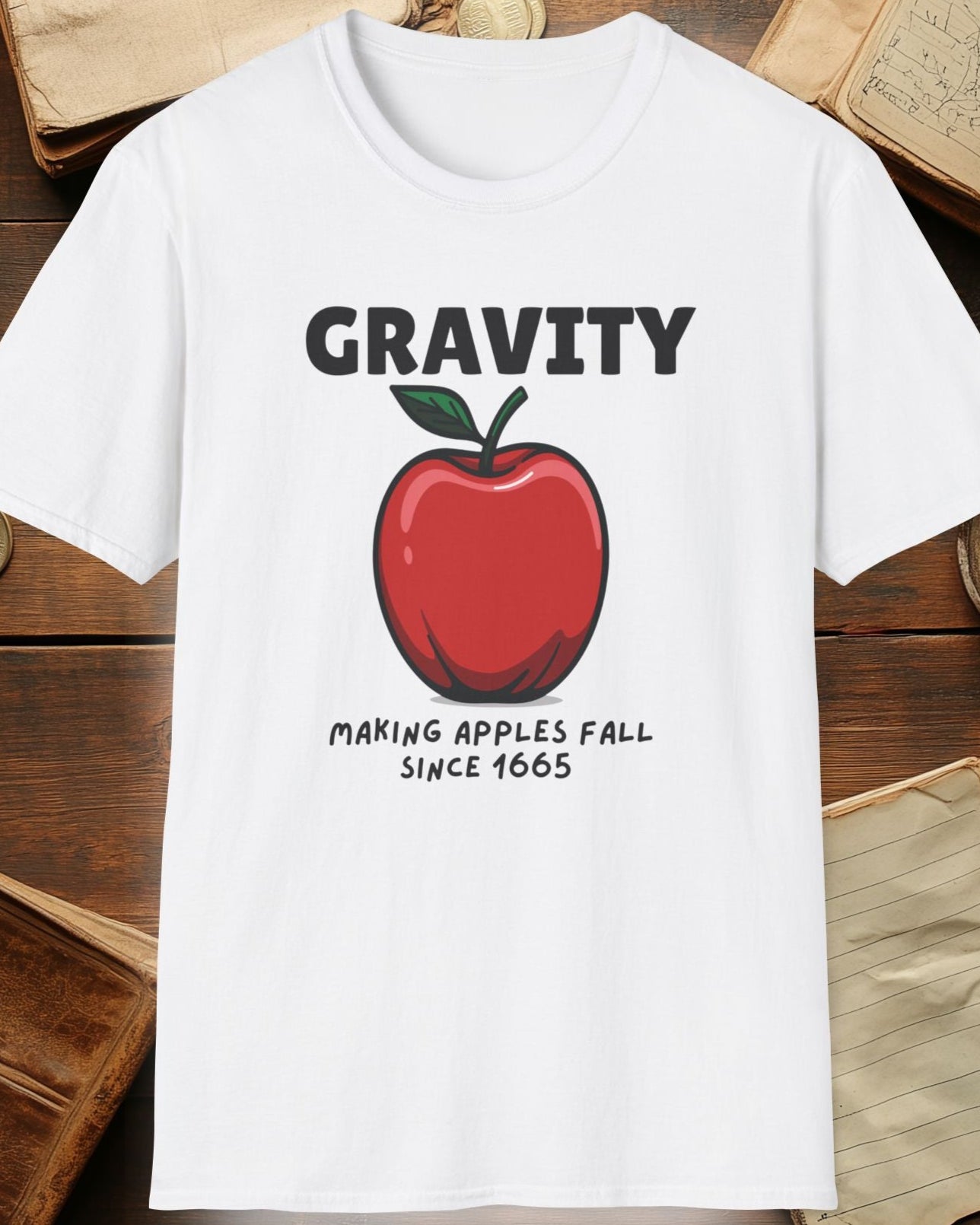 white tshirt with a apple and the text "Gravity, Making apples fall since 1665"