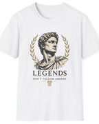 A white short-sleeve crewneck t-shirt featuring a graphic print of a classical bust with a laurel wreath and the text 'LEGENDS DON'T FOLLOW ORDERS' in black and gold.