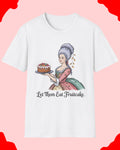 White t-shirt with a graphic of a woman holding a fruitcake and text 'Let Them Eat Fruitcake' on a white background.