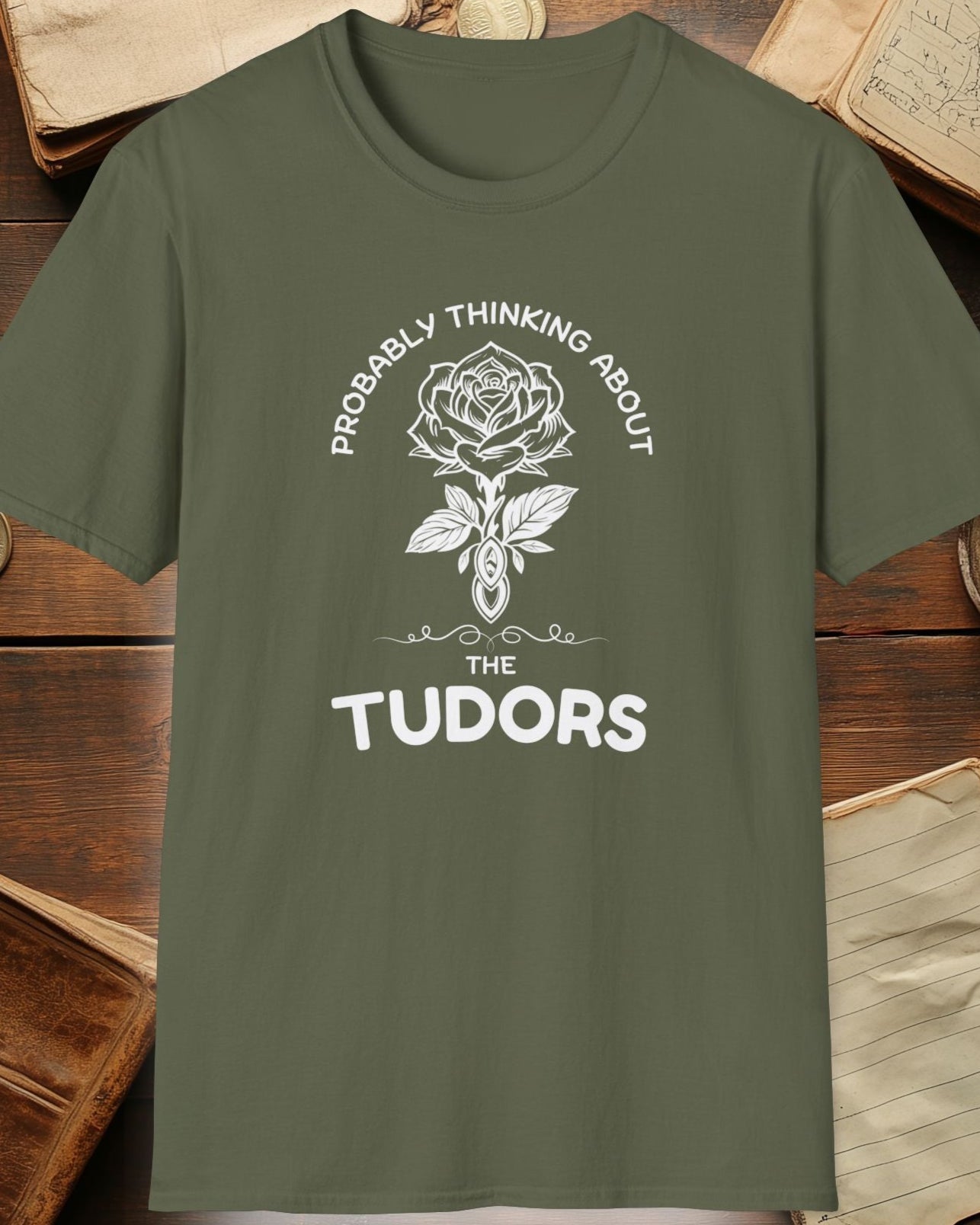 green tshirt with a rose and the text "Probably thinking about the tudors"