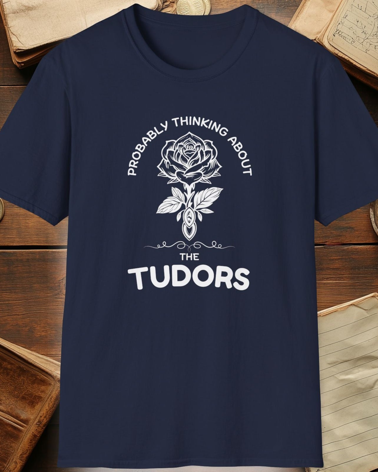 navy tshirt with a rose and the text "Probably thinking about the tudors"
